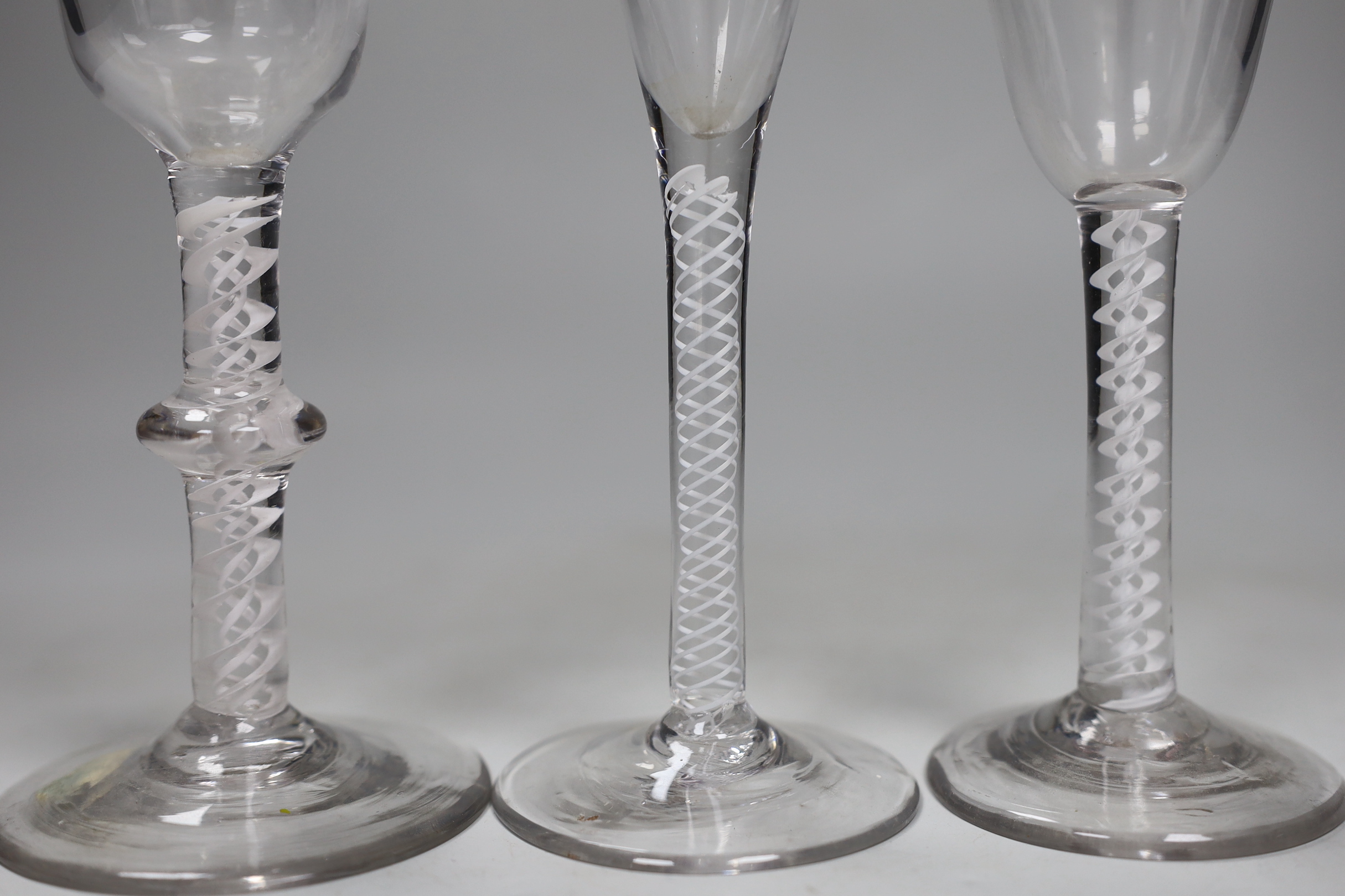 Three George III DSOT stem wine glasses, tallest 17.5cm high